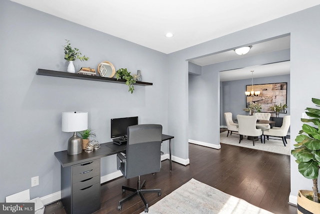 office space with hardwood / wood-style flooring, baseboards, and a chandelier