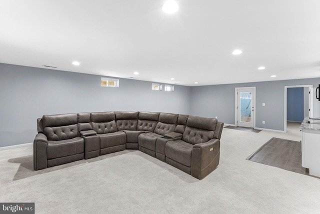 carpeted living area featuring recessed lighting, visible vents, and baseboards