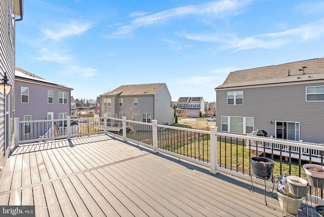 wooden terrace with a residential view