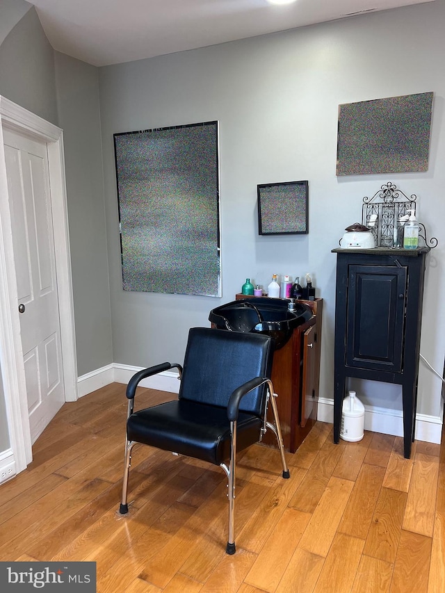 sitting room featuring light wood-style flooring and baseboards