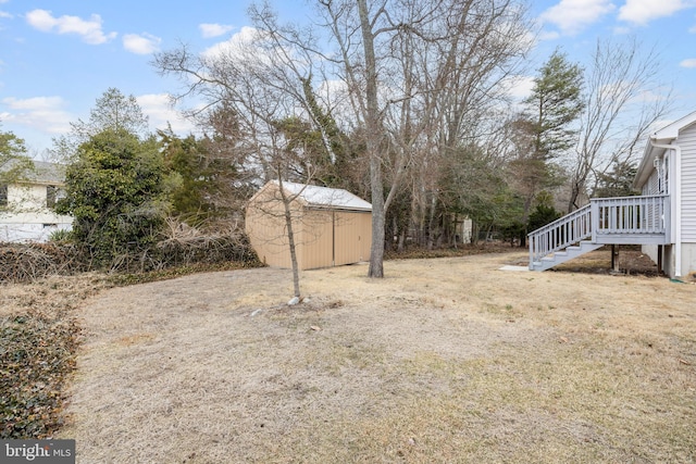 view of yard featuring a shed and an outdoor structure