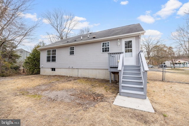 back of property with fence