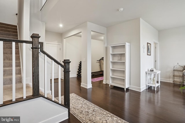 entryway featuring stairs, recessed lighting, wood finished floors, and baseboards