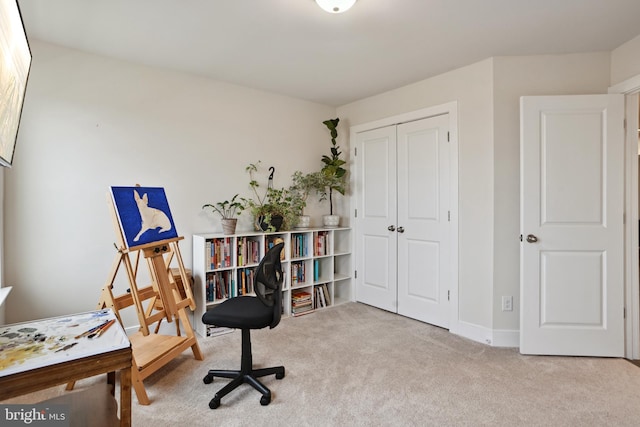 office space with carpet and baseboards