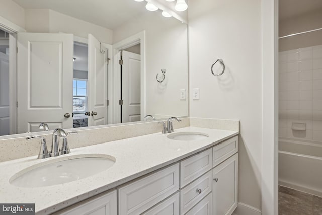 full bath featuring double vanity,  shower combination, and a sink