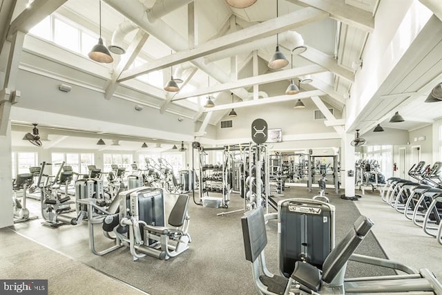 gym with visible vents and high vaulted ceiling