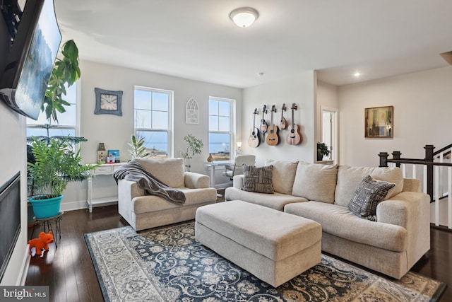 living area with dark wood finished floors and baseboards