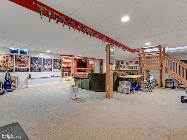 misc room with carpet floors, stairway, a drop ceiling, and recessed lighting