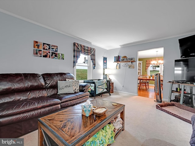 carpeted living room featuring baseboards, ornamental molding, and a notable chandelier