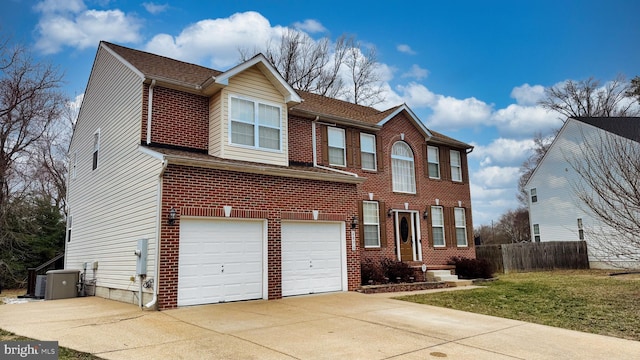 view of front of home with driveway, roof with shingles, an attached garage, fence, and brick siding