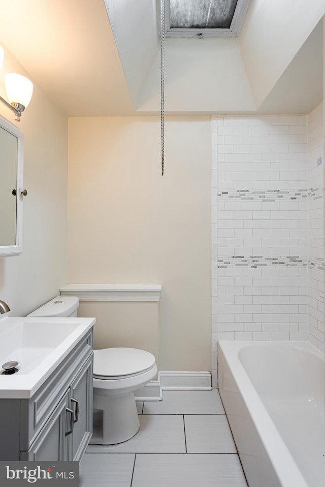 bathroom featuring tile patterned flooring, toilet, vanity, and baseboards