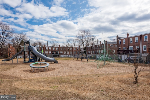 communal playground featuring a residential view