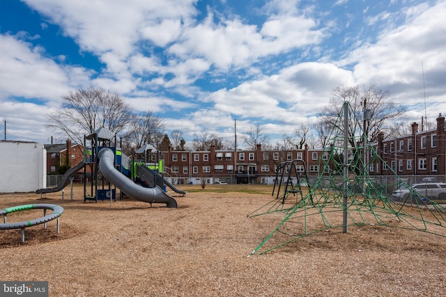 communal playground featuring a residential view