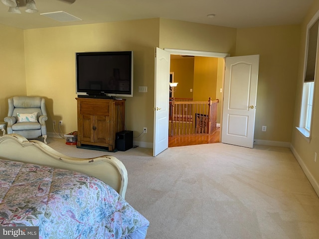 carpeted bedroom with baseboards