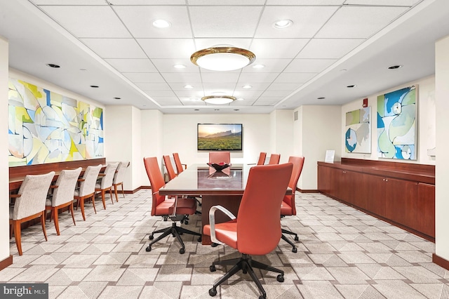 dining area featuring recessed lighting, baseboards, and a drop ceiling