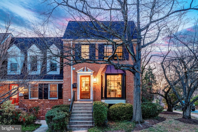 view of front of home featuring brick siding