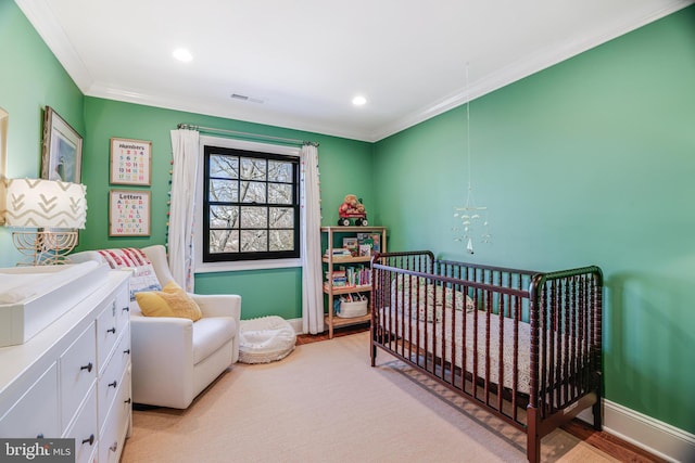 bedroom featuring a crib, baseboards, visible vents, crown molding, and recessed lighting