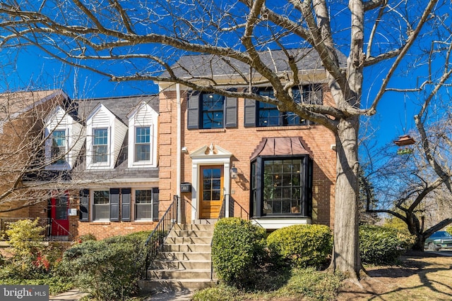 view of front of home featuring brick siding