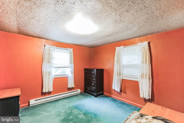 unfurnished bedroom featuring a textured ceiling, baseboard heating, and carpet