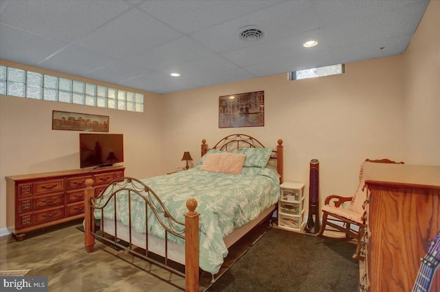 bedroom featuring recessed lighting, visible vents, and a drop ceiling