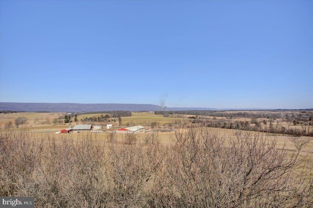 exterior space with a rural view