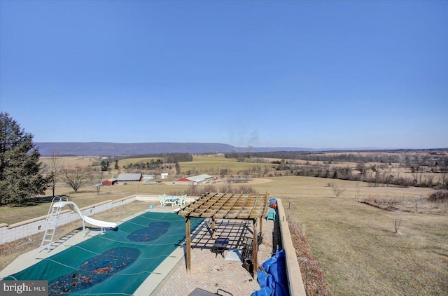 birds eye view of property with a rural view