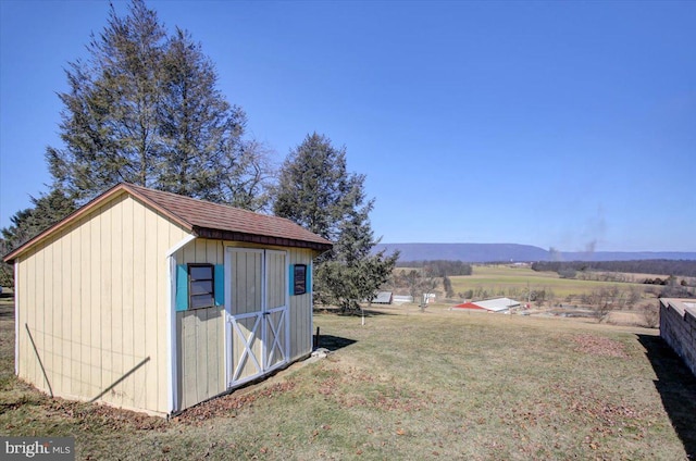 view of shed featuring a rural view