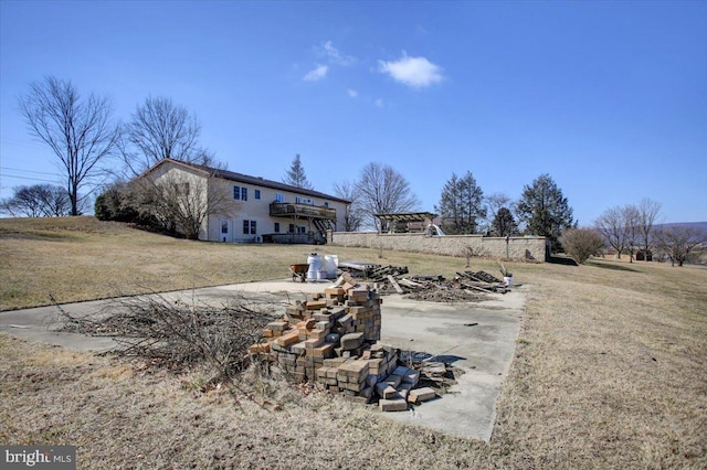 view of yard featuring a deck and a patio area