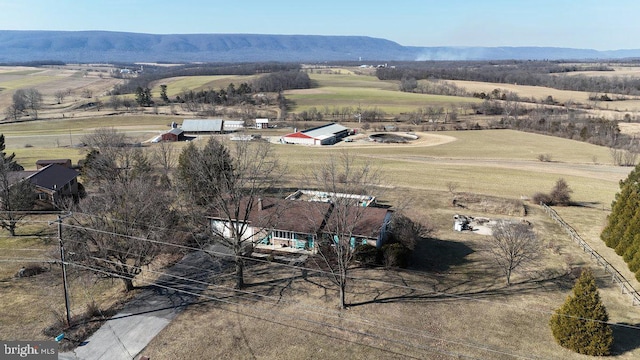 drone / aerial view featuring a rural view and a mountain view