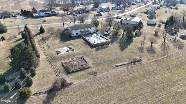 birds eye view of property with a rural view