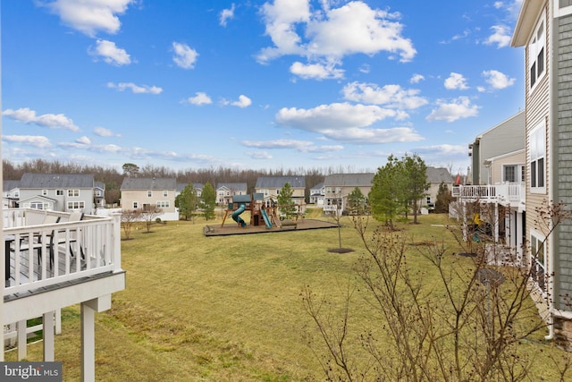 view of yard with a residential view and a playground