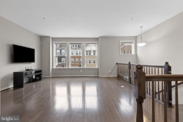 living room featuring baseboards and wood finished floors