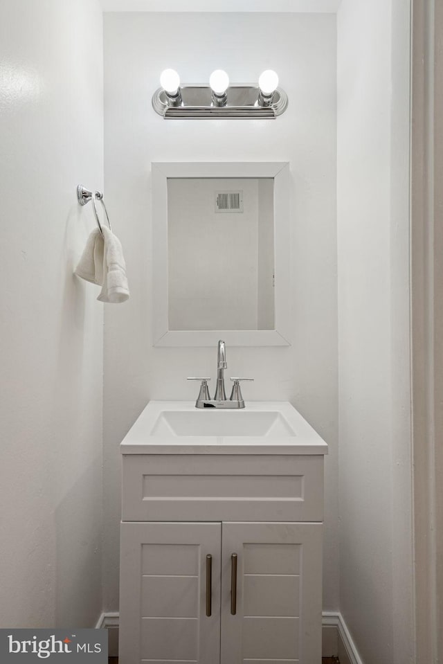 bathroom featuring visible vents and vanity