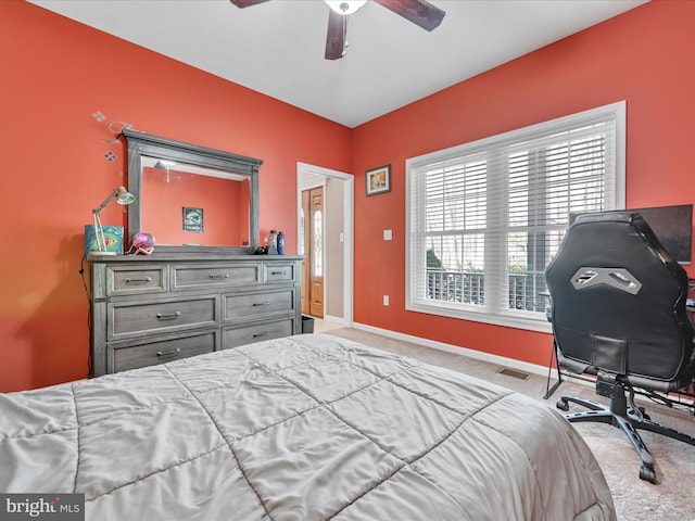 bedroom with a ceiling fan, carpet, visible vents, and baseboards