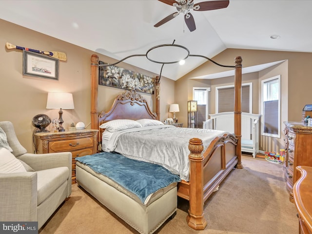 bedroom with light carpet and vaulted ceiling