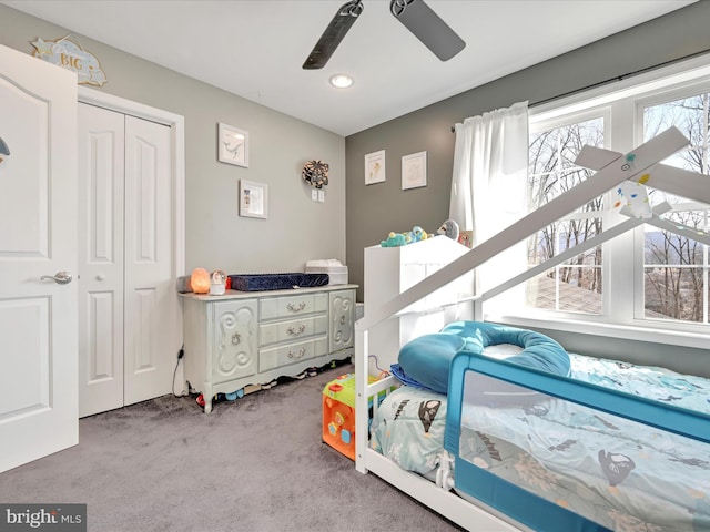 bedroom with carpet floors, a closet, and ceiling fan