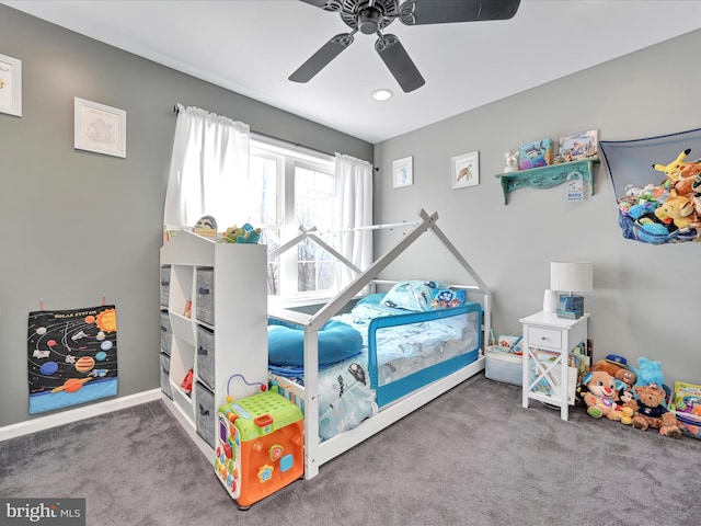 carpeted bedroom with a ceiling fan