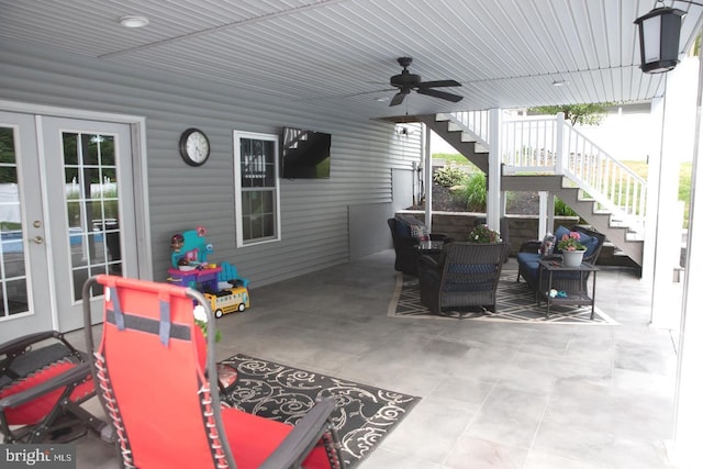 view of patio / terrace featuring stairway, a ceiling fan, and french doors