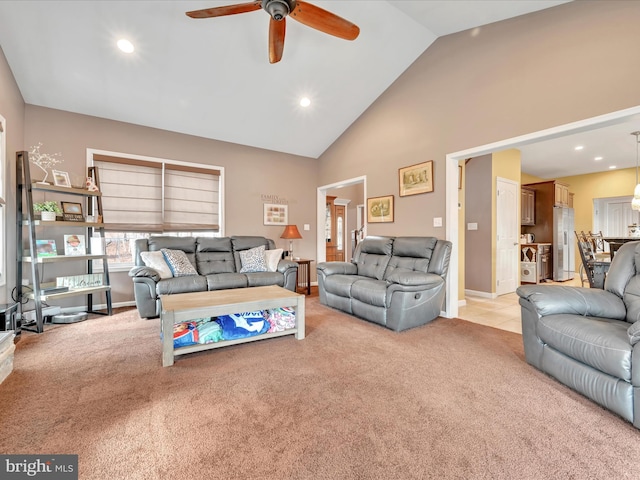 living area featuring high vaulted ceiling, recessed lighting, light colored carpet, and a ceiling fan