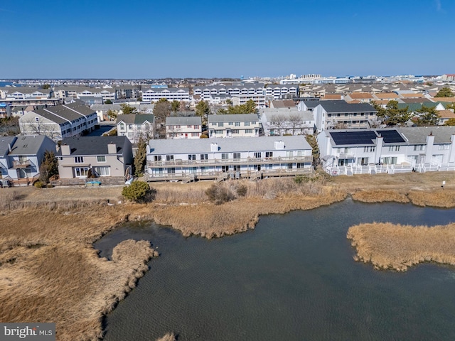 aerial view featuring a water view and a residential view