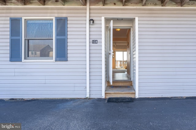 view of exterior entry featuring crawl space