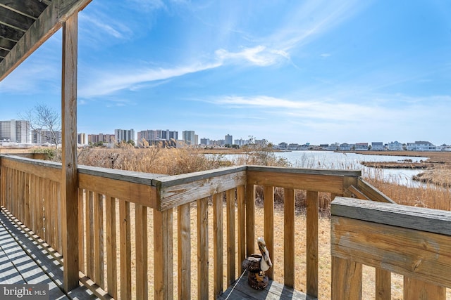 deck featuring a city view and a water view