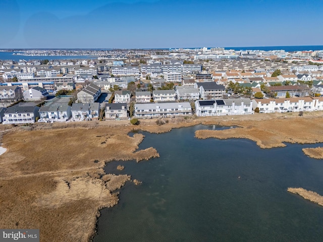 aerial view featuring a residential view and a water view