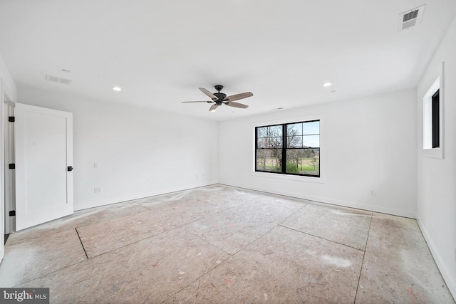 spare room featuring ceiling fan, recessed lighting, visible vents, and baseboards