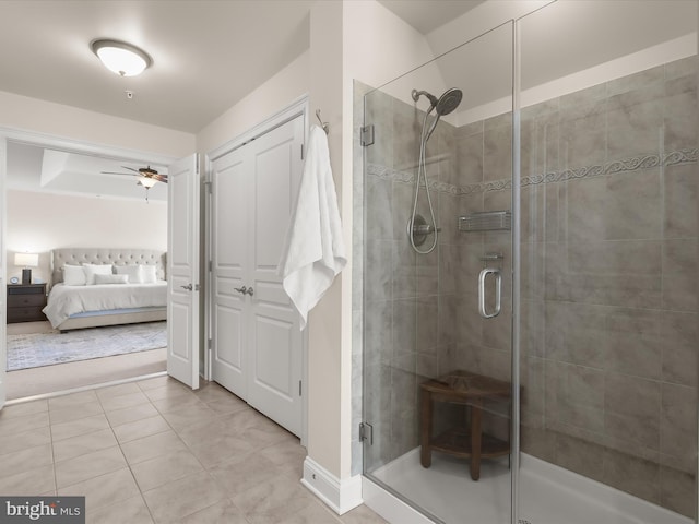 full bathroom featuring tile patterned floors, a shower stall, connected bathroom, and ceiling fan