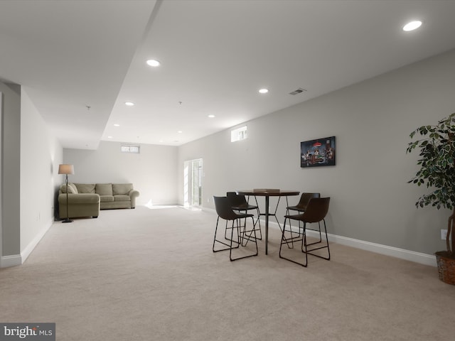 dining area featuring baseboards, recessed lighting, visible vents, and light carpet