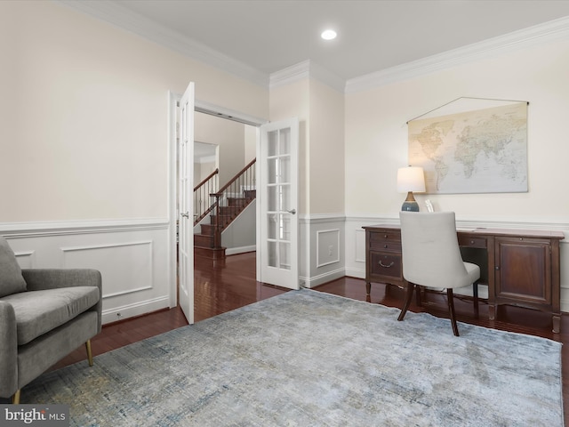 office with wood finished floors, a wainscoted wall, recessed lighting, ornamental molding, and french doors