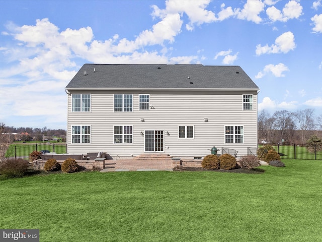 rear view of house with a patio area, a lawn, entry steps, and fence