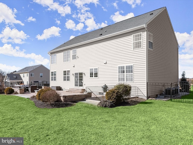 back of house with a patio area, central AC, a yard, and fence