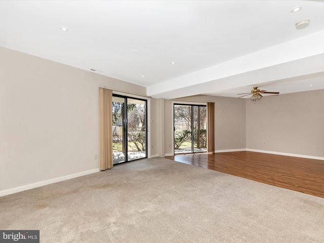 carpeted empty room featuring ceiling fan, baseboards, and recessed lighting